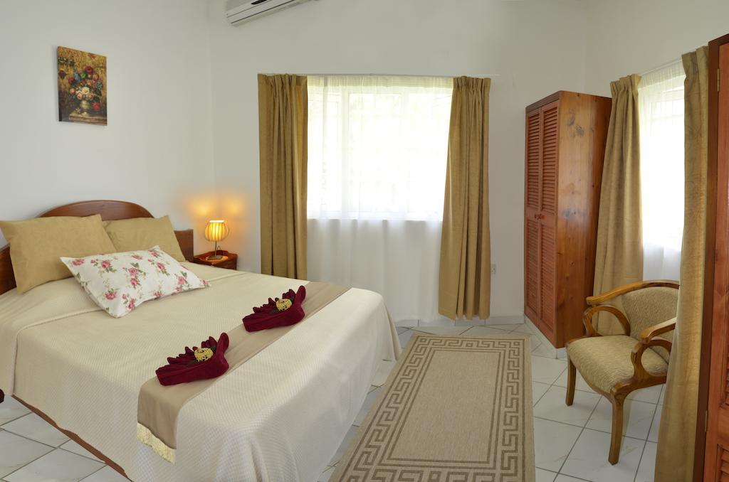 Ixora Villa Anse Royale Cameră foto